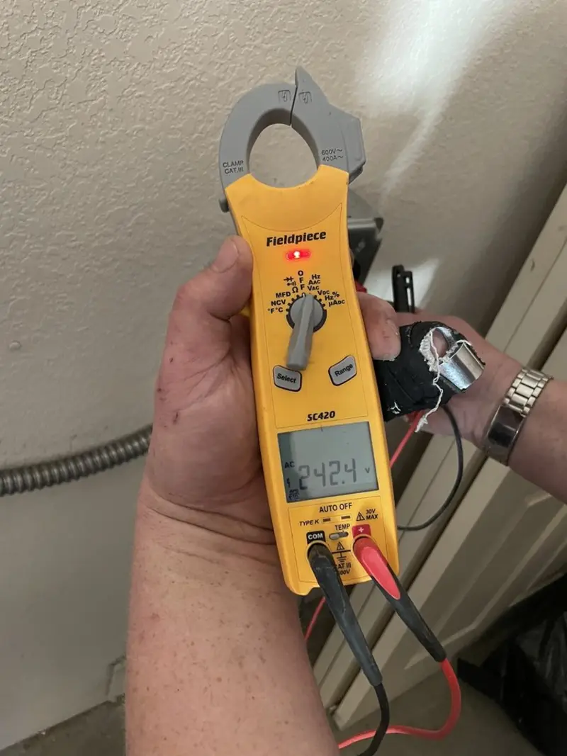 Voltage testing with clamp meter during Electrical Installation Services in Woodbridge